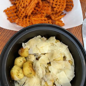 The Boathouse at Forest Park signature dishes Sweet Potato Waffle FriesPulled Pork SandwichBrisket Toasted Ravioli